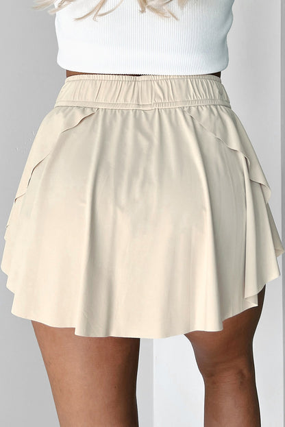 Beigefarbener Tennis-Skort mit Kordelzug und hoher Taille
